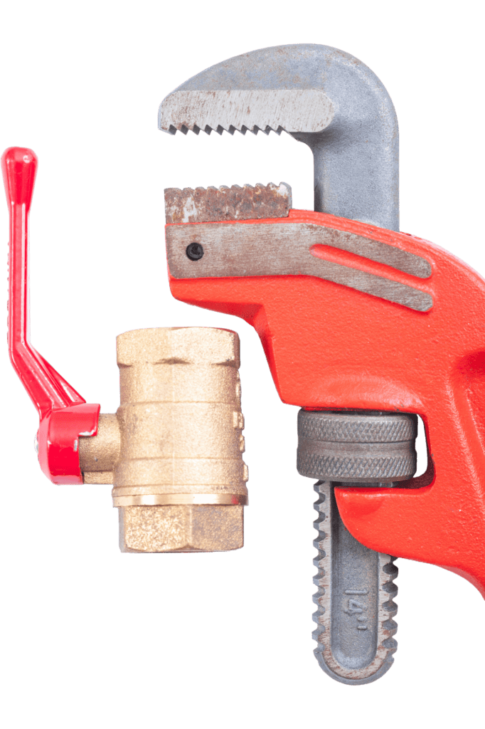 Close-up of plumbing pipe wrench and valve tool for repairs.